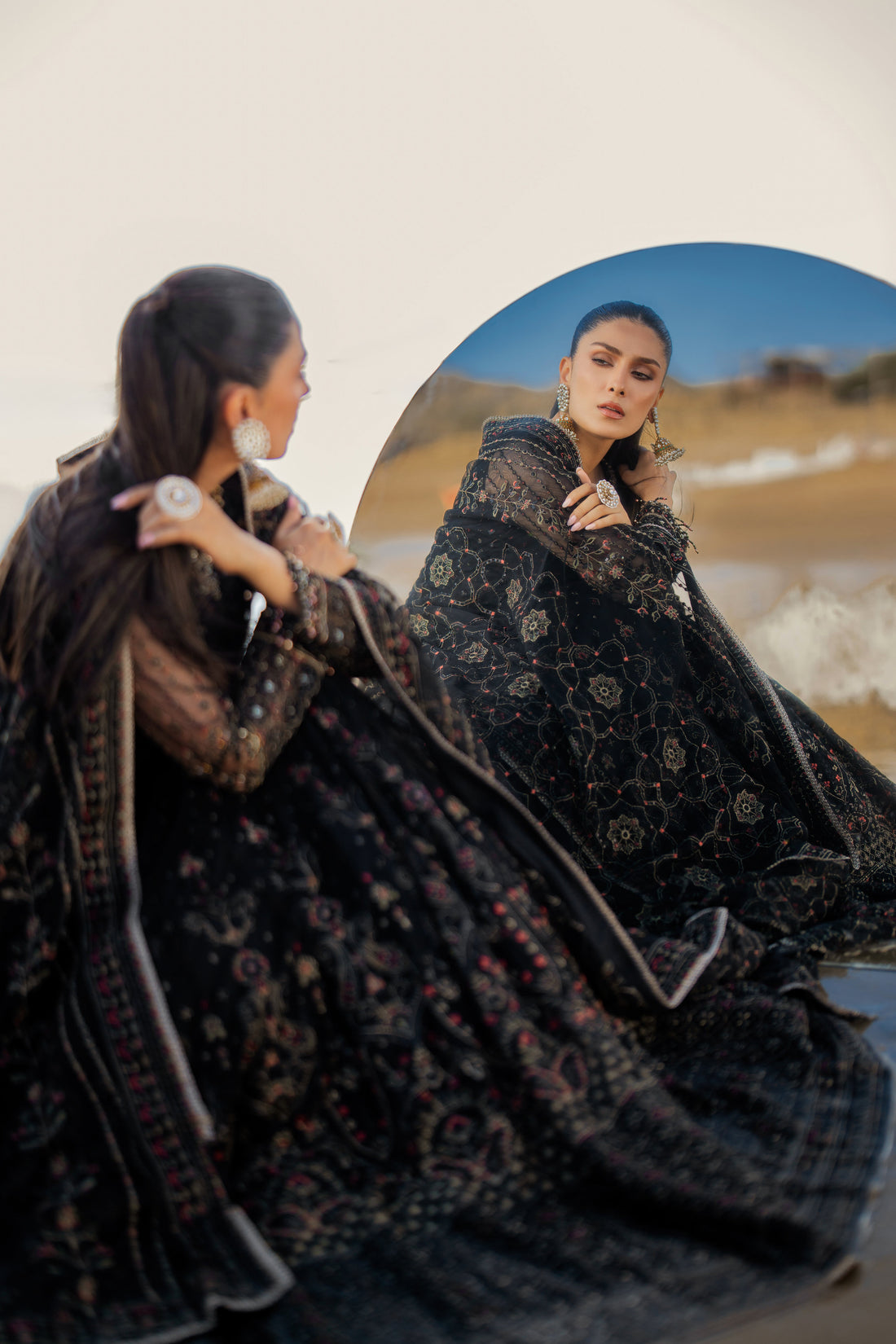 NAQSHI Blain black net maxi frock with round adda‑embellished neckline, heavy hand‑adda floral embroidery, sequin accents, contrasting panel details and matching dupatta.