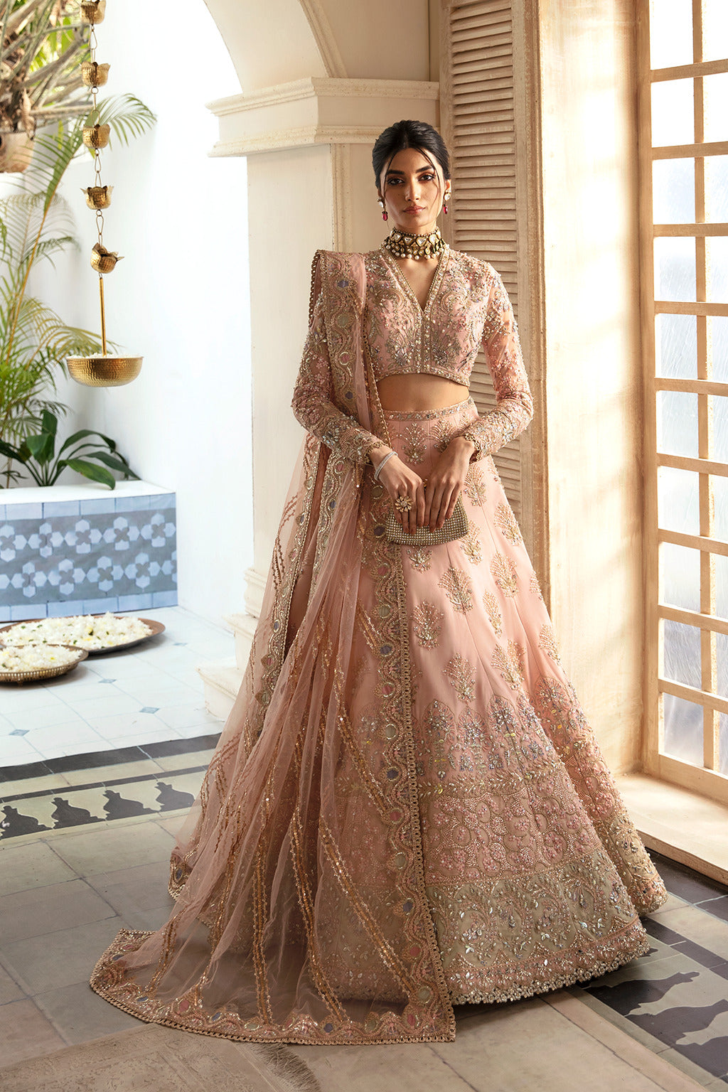 Soraya Inaya peach, seaweed green and gold net lehenga choli