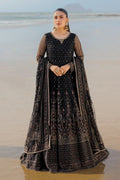 Model wearing full NAQSHI Blain set: black embellished net frock, plain straight PK raw‑silk pants, ornate dupatta with heavy embroidery & tassels.