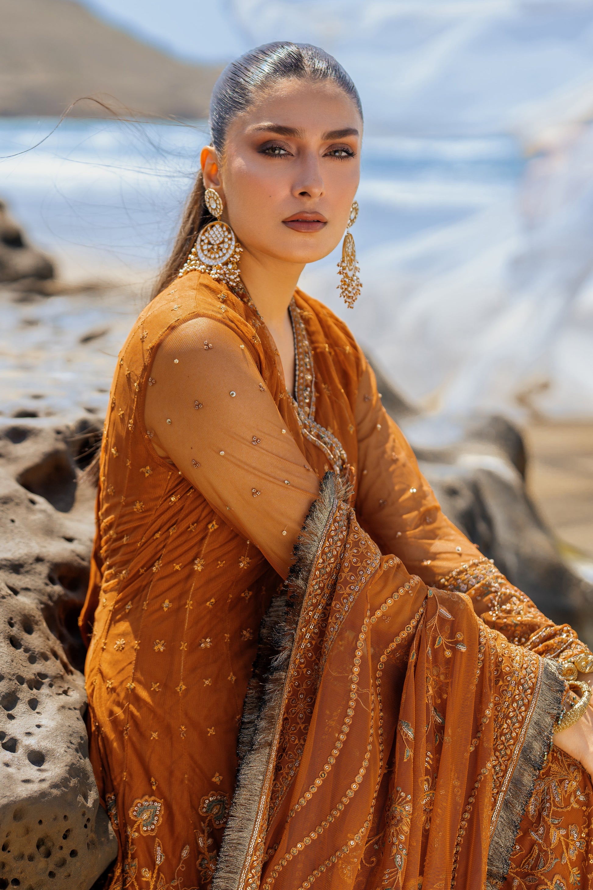 Close-up of NAQSHI Tianaa sleeve cuff showing dense hand-adda embroidery, sequin work, lace edging and signature handmade tassels.