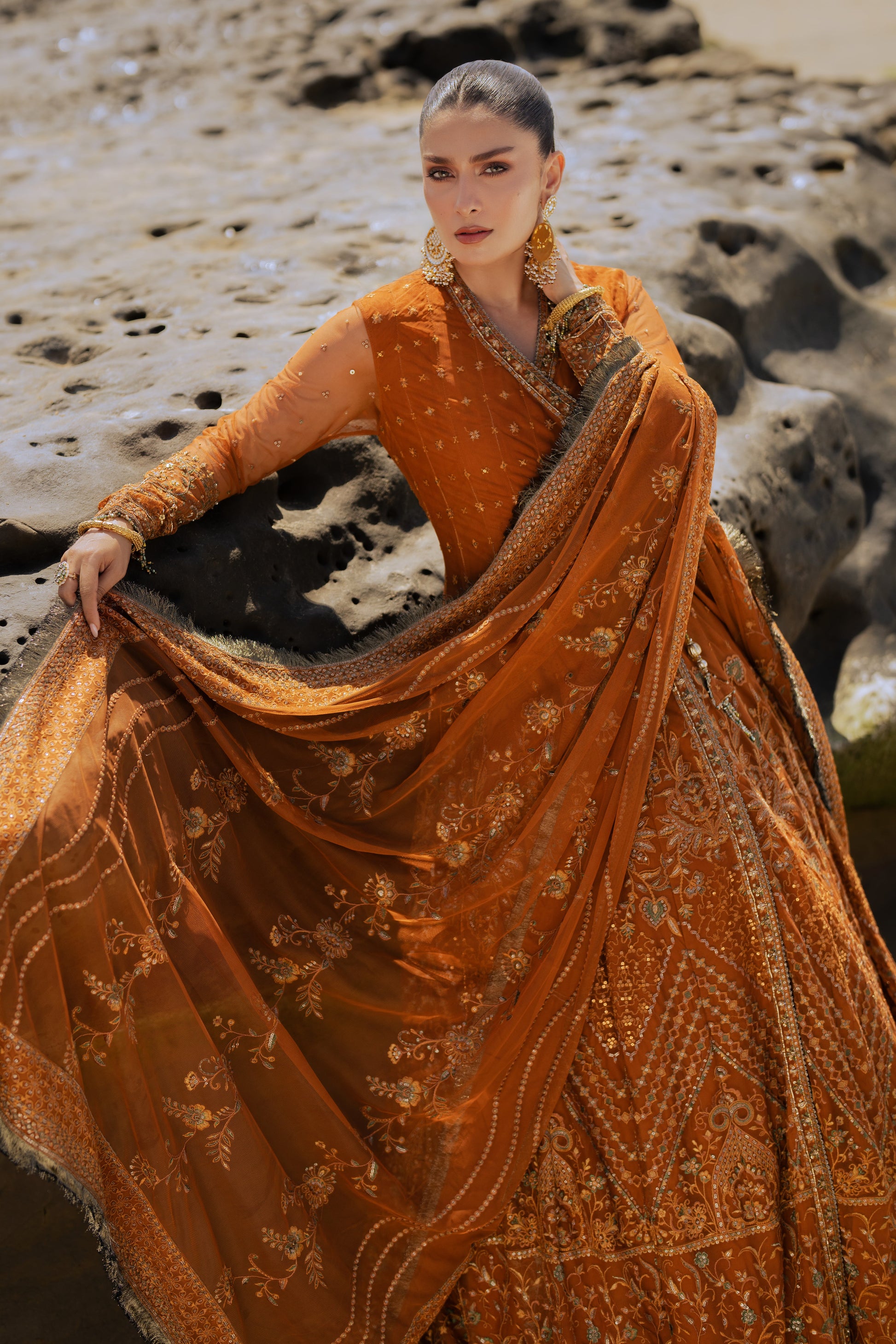 Detailed shot of NAQSHI Tianaa frock bodice featuring mini motif spray, textured embroidery, Mughal-inspired compositions and geometric patterns on rust net.