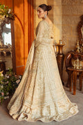 Back view of Roshan Ara skin gold bridal dress showing long gown trail and wide lehenga flare, elegant ready made wedding attire.