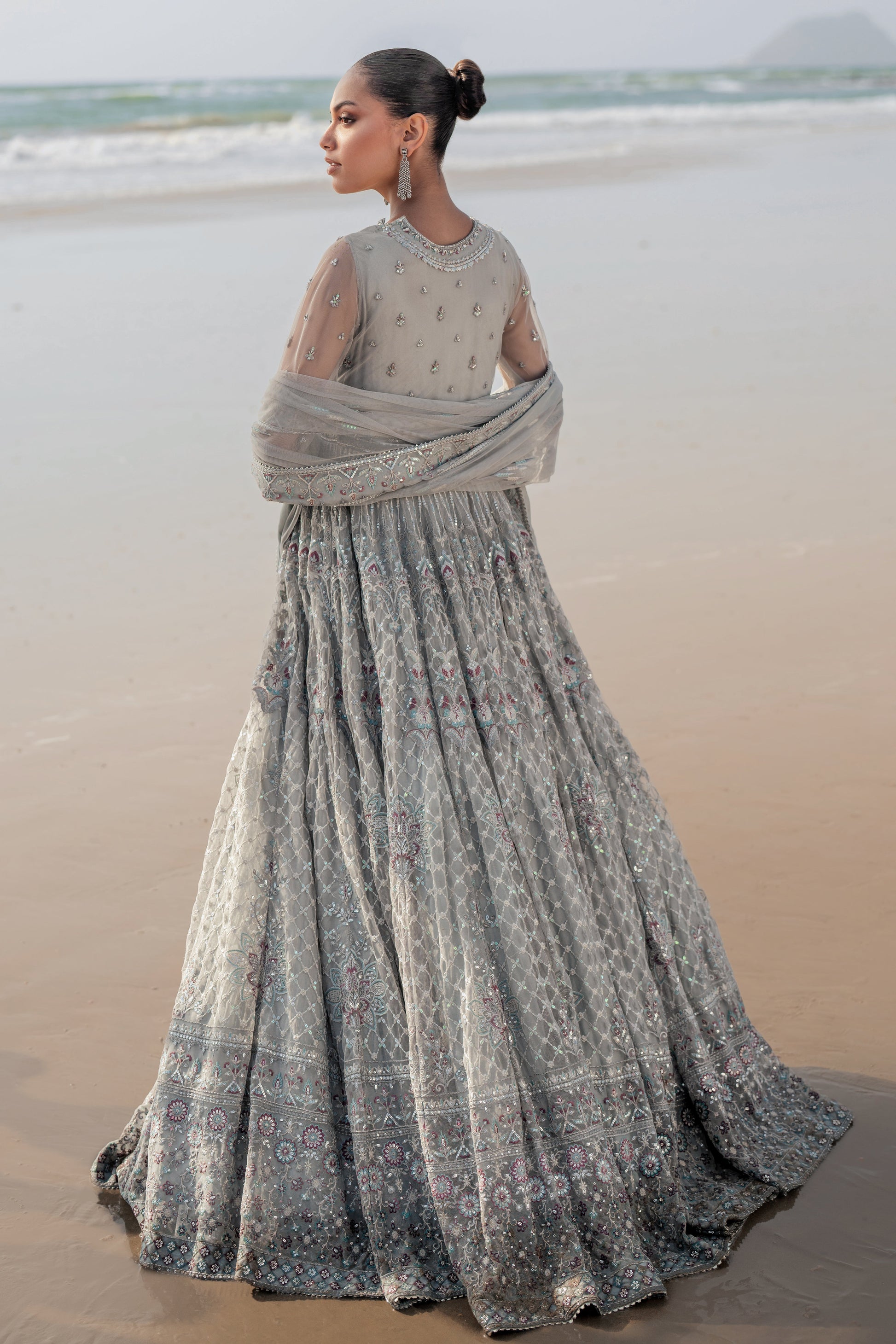 Close‑up of NAQSHI Valeria frock bodice highlighting intricate hand‑adda embellishments: kora, dabka, sitara, thread and sequin work with floral motifs and luxury border.