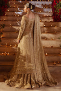 Back side view of Roshan Ara skin gold wedding outfit showing dupatta trail and layered hem detailing, traditional ready made bridal attire