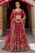 NAQSHI Qurbat fuchsia red bridal raw-silk lehenga front view with round embroidered neckline, scalloped three-quarter sleeves, richly hand-adda embellished choli, and layered lehenga.