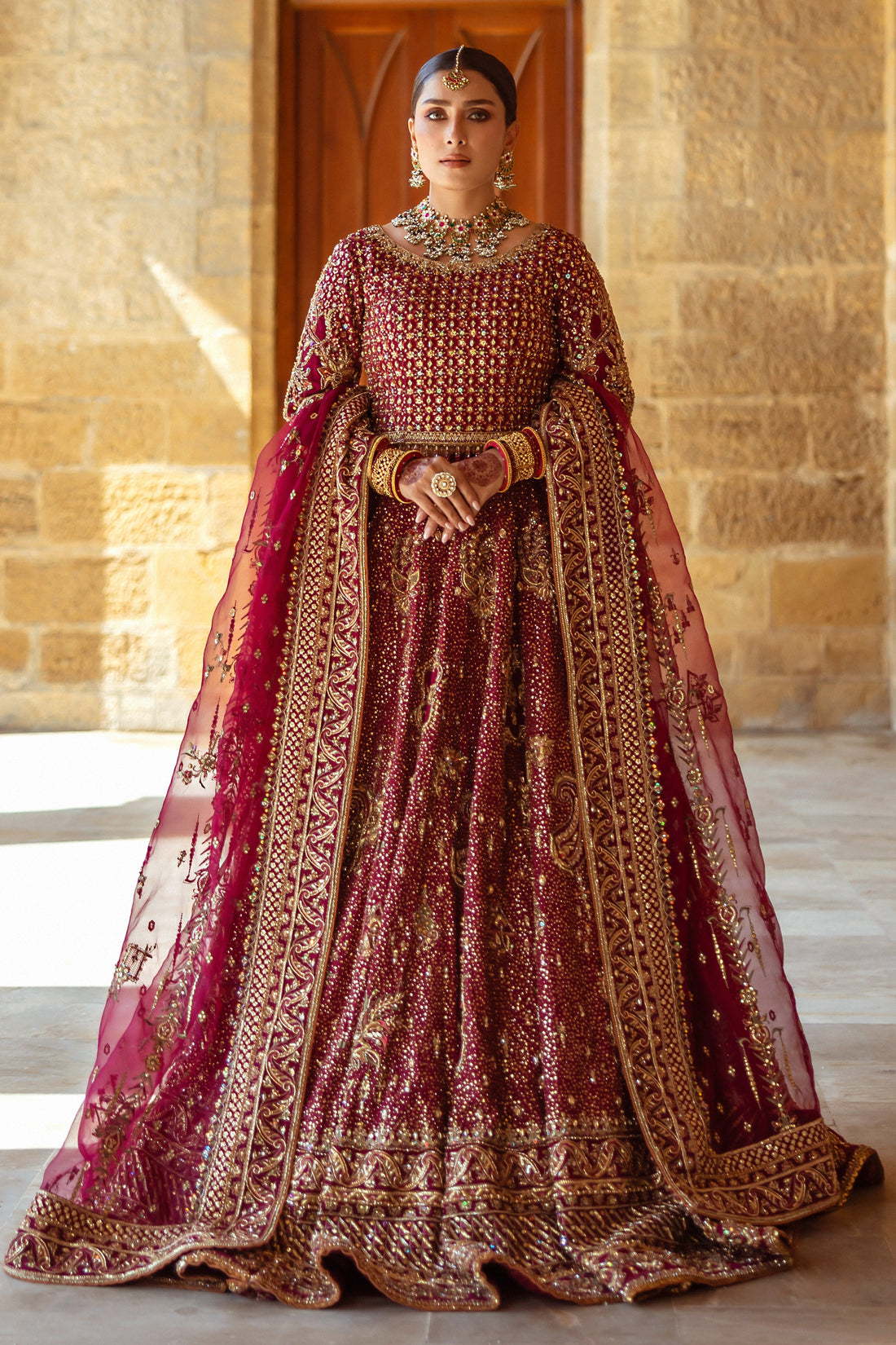 Kandhari plum bridal lehenga choli by NAQSHI, full front view with heavily embellished raw silk choli, flared lehenga, organza dupatta and matching clutch, ready to wear 4-piece wedding outfit.