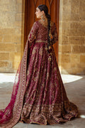 Back view of Kandhari plum wedding dress showing wide circular lehenga flare and long dupatta trail, traditional ready made barat bridal attire.