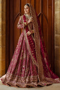 Full standing look of Kandhari plum lehenga choli featuring layered borders and rich embroidery, complete formal barat wedding outfit.