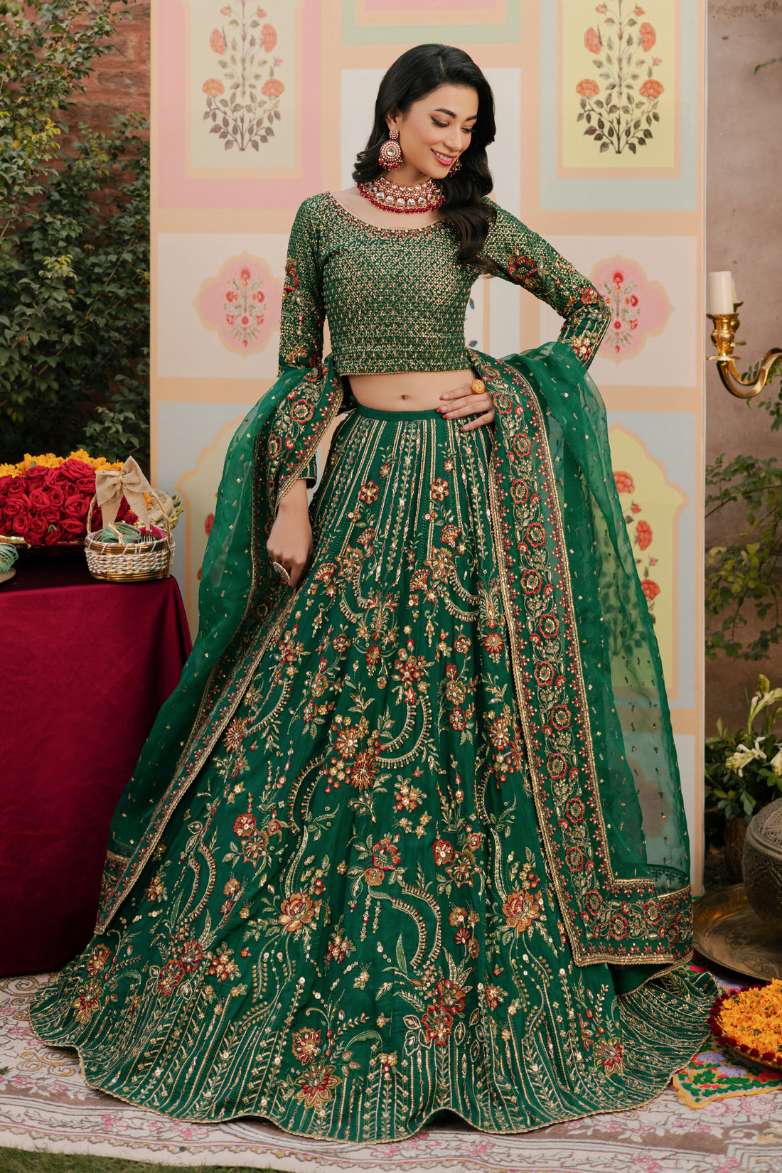 NAQSHI Danir festive green raw‑silk lehenga choli showing round neckline adorned with heavy sequin and hand‑adda embroidery featuring kora, dabka, stones, sitara, crystals and threadwork.