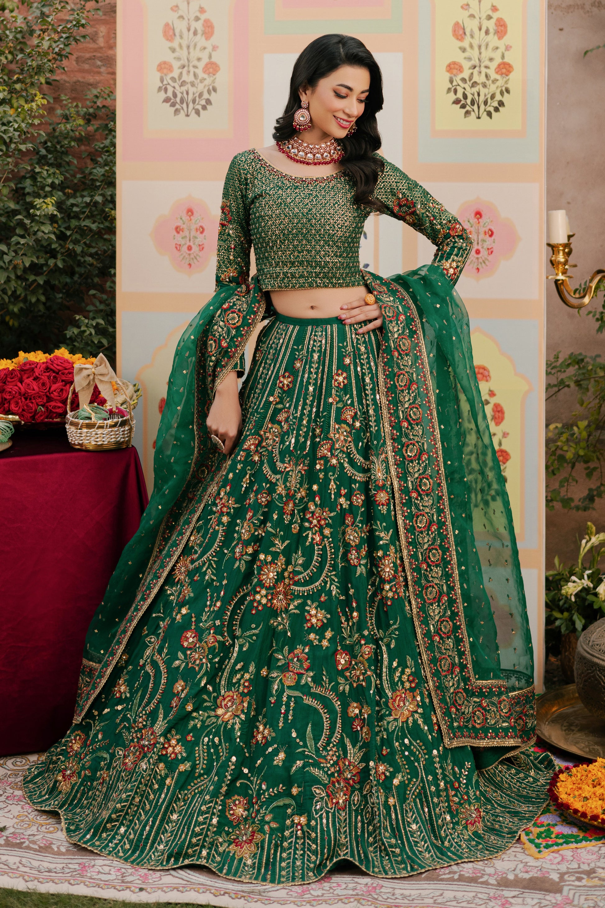 NAQSHI Danir festive green raw‑silk lehenga choli showing round neckline adorned with heavy sequin and hand‑adda embroidery featuring kora, dabka, stones, sitara, crystals and threadwork.