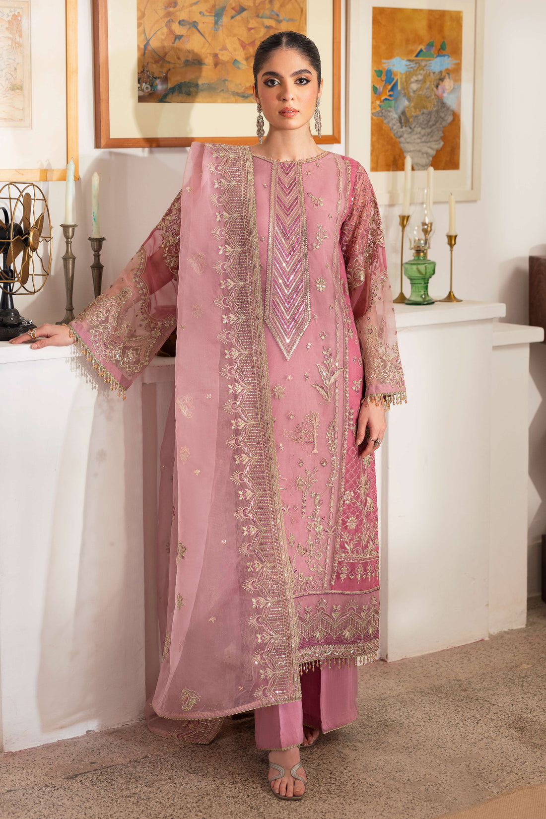 NAQSHI Nayab pastel-pink organza straight-paneled long shirt featuring near-neck geometric embroidery, heavy sequin texture, berry-pink patch panels on sides and sleeves.