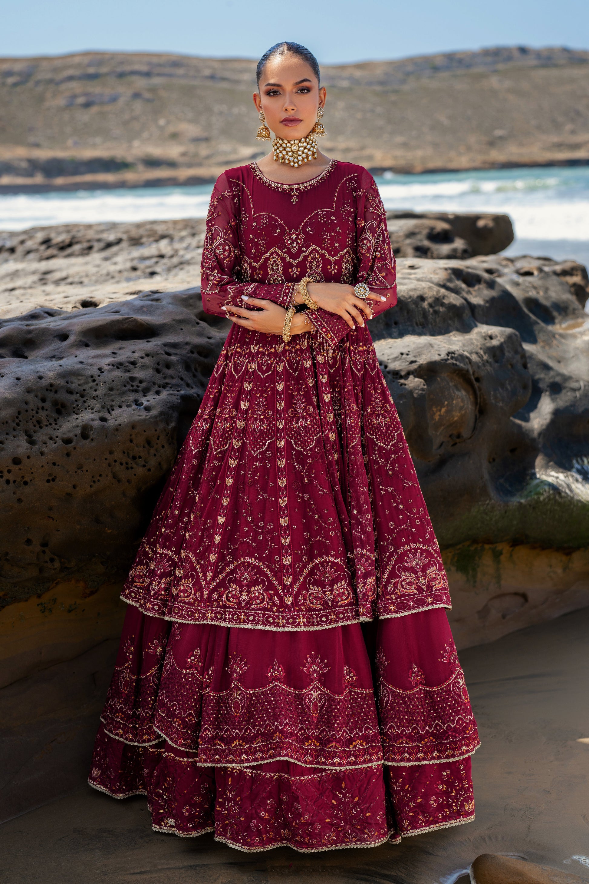 Side view of NAQSHI Zureal showcasing frock’s multi-layered crinkle fabric, Mughal-inspired floral and dome motifs, sequin accents and heavy embroidered border.
