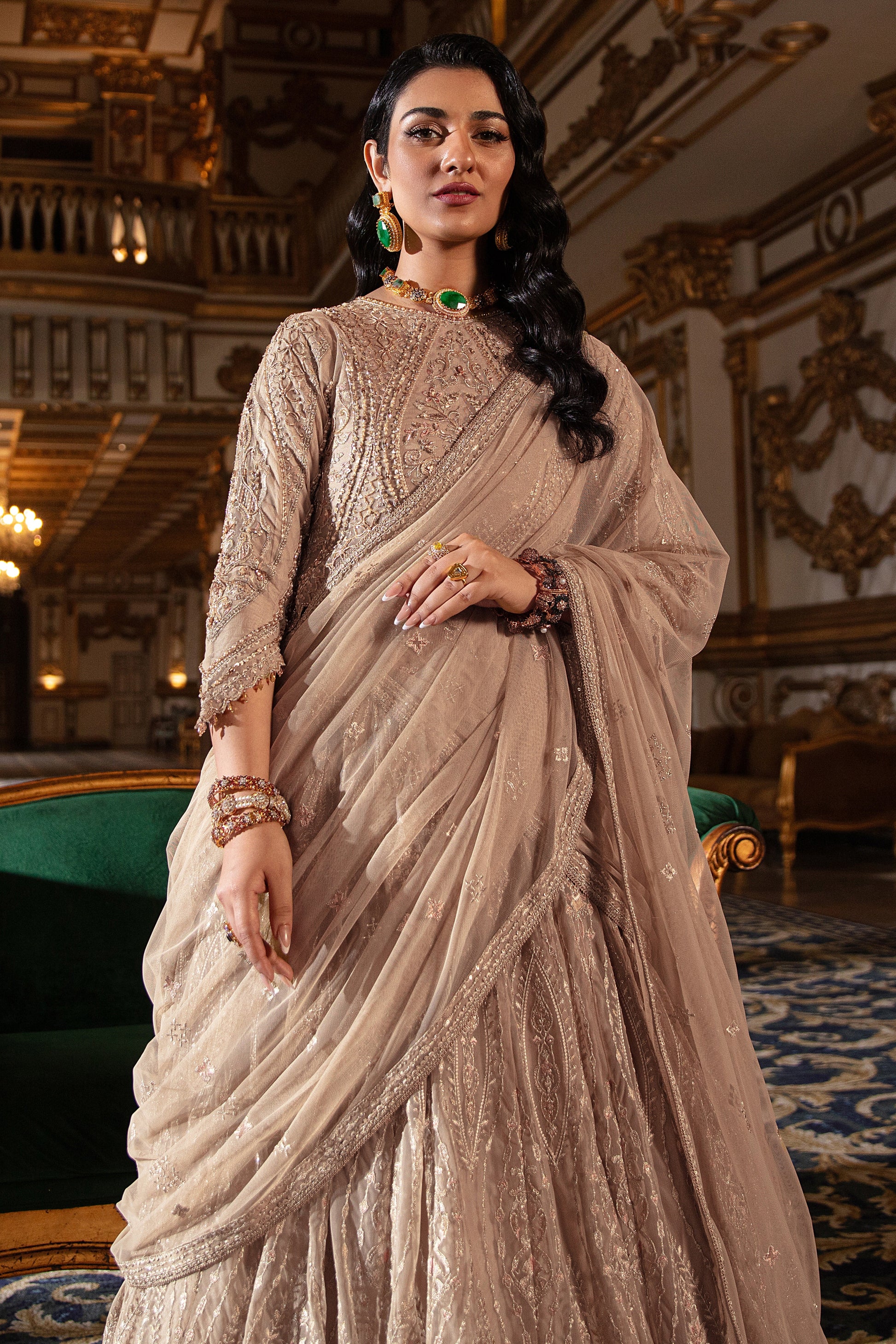 Detailed view of Areeza lehanga panel embroidered with heavy motifs, sequin details and lace-facing trim on net fabric.  