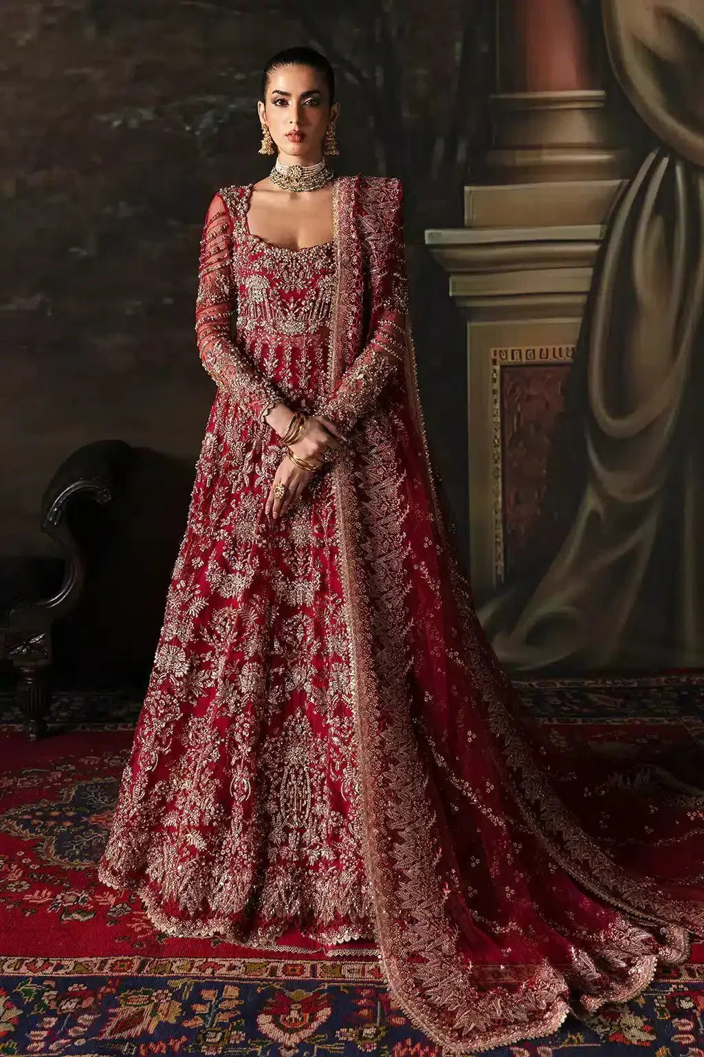 Afrozeh The Brides Edit 23 Adelaide bridal dress in brick red with heavy gold embroidery, full sleeves, and matching dupatta, front view.