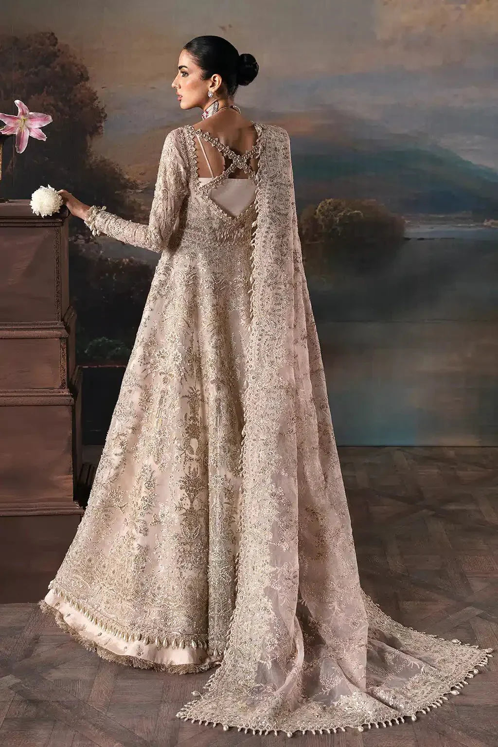 Back view of Afrozeh Clara bridal dress from The Brides Edit 23, highlighting crisscross back design and flowing embroidered dupatta.