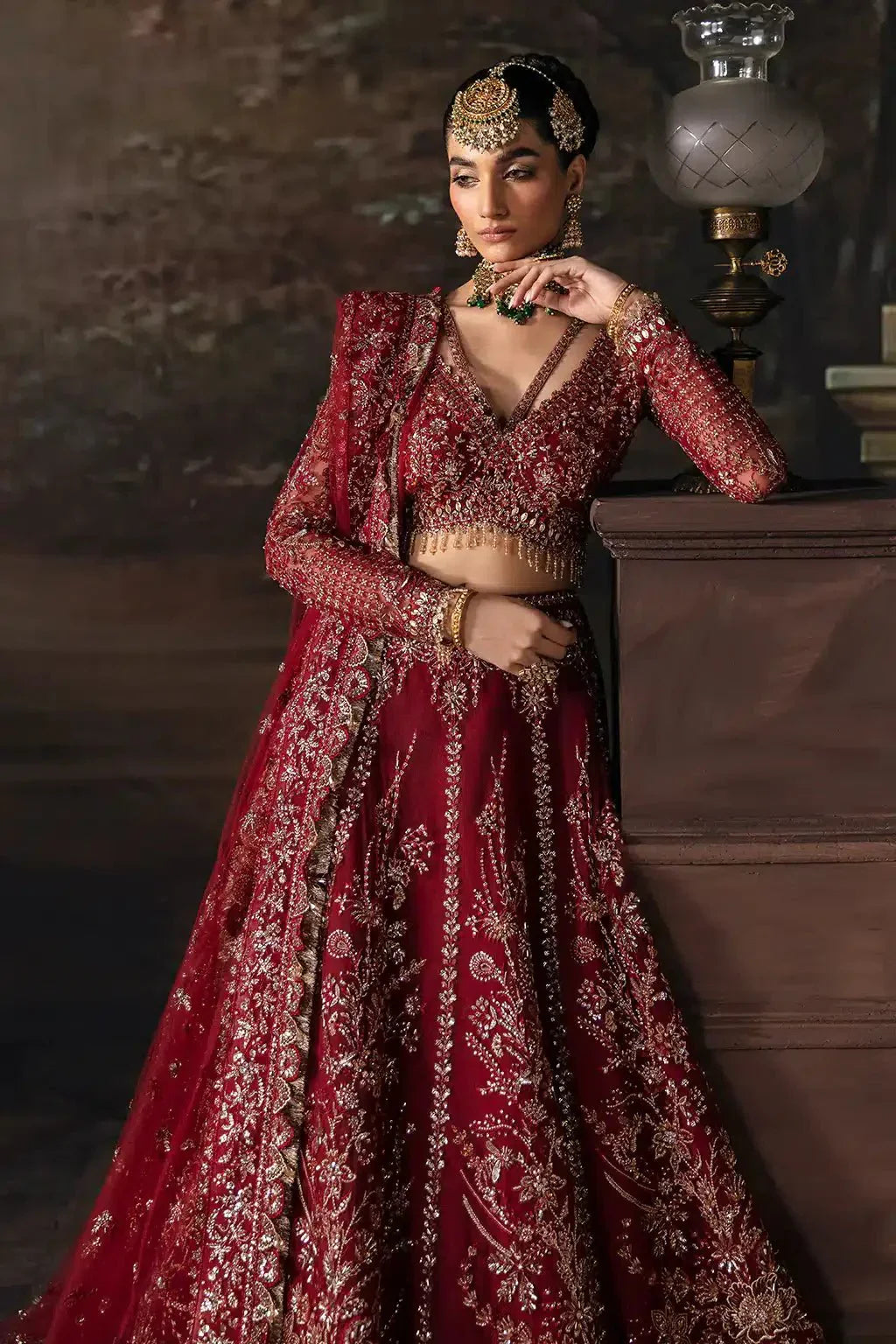 Afrozeh The Brides Edit 23 Emmaine maroon bridal lehnga choli with sequin and threadwork embroidery, paired with full-sleeve net blouse.