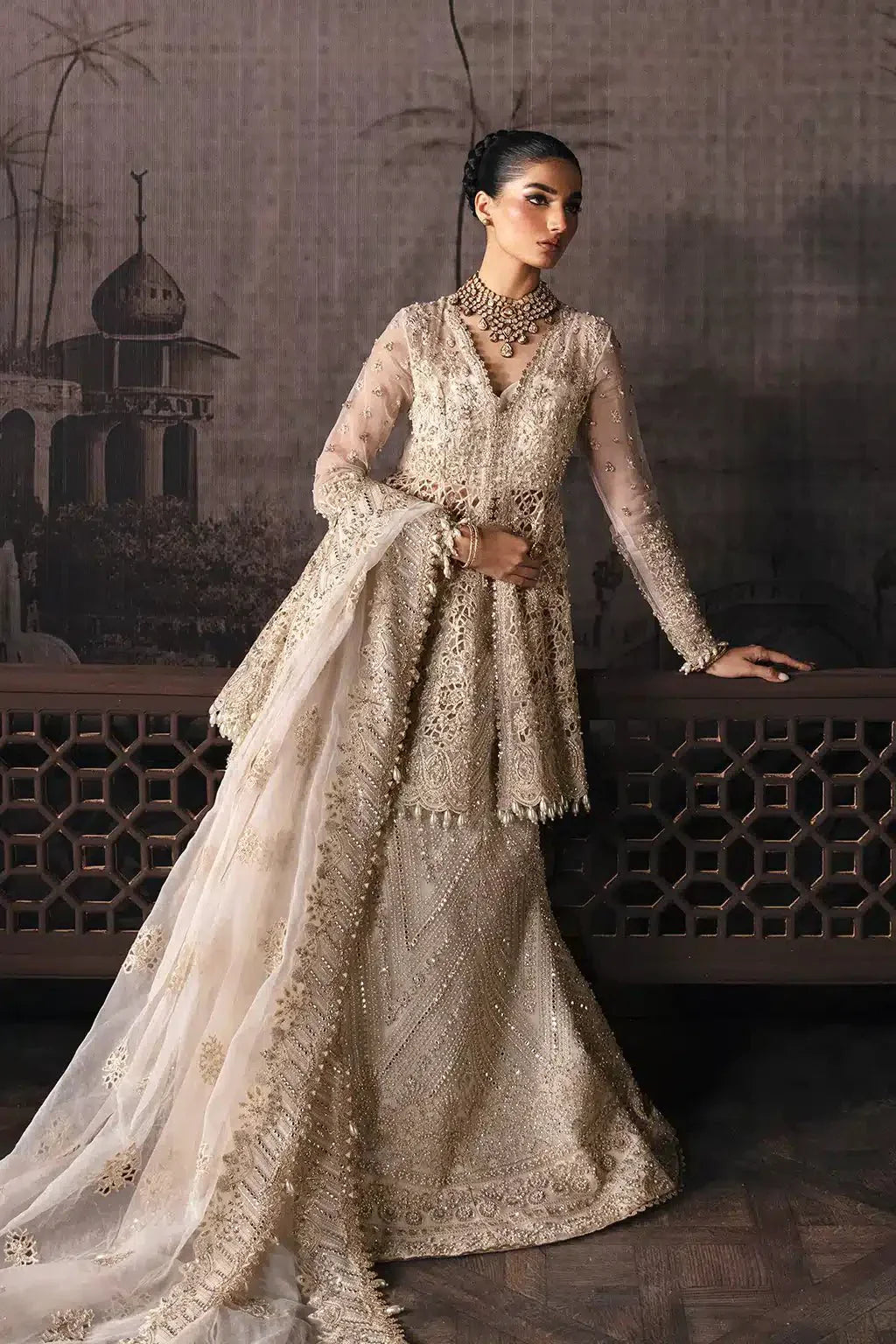 Afrozeh The Brides Edit 23 Helena bridal attire with ornate embroidery, sheer sleeves, and a heavily embellished dupatta in off-white tones.