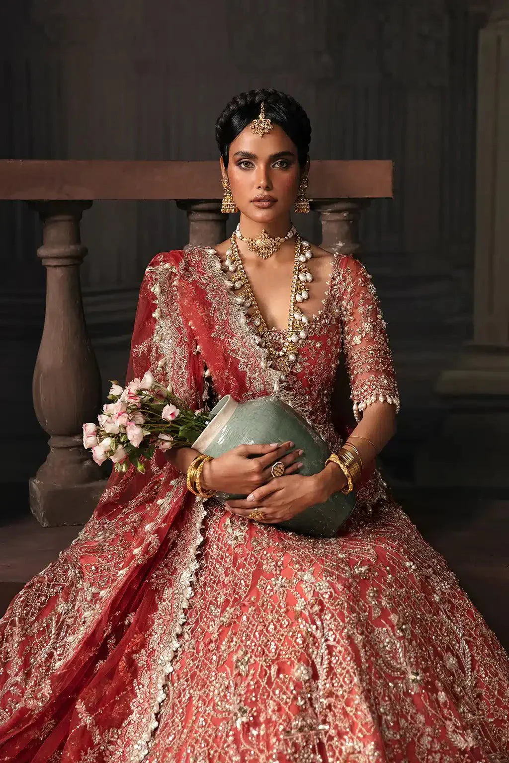 Afrozeh The Brides Edit 23 Lavinia bridal dress in rust net fabric with intricate embroidery and open back design, perfect for weddings.