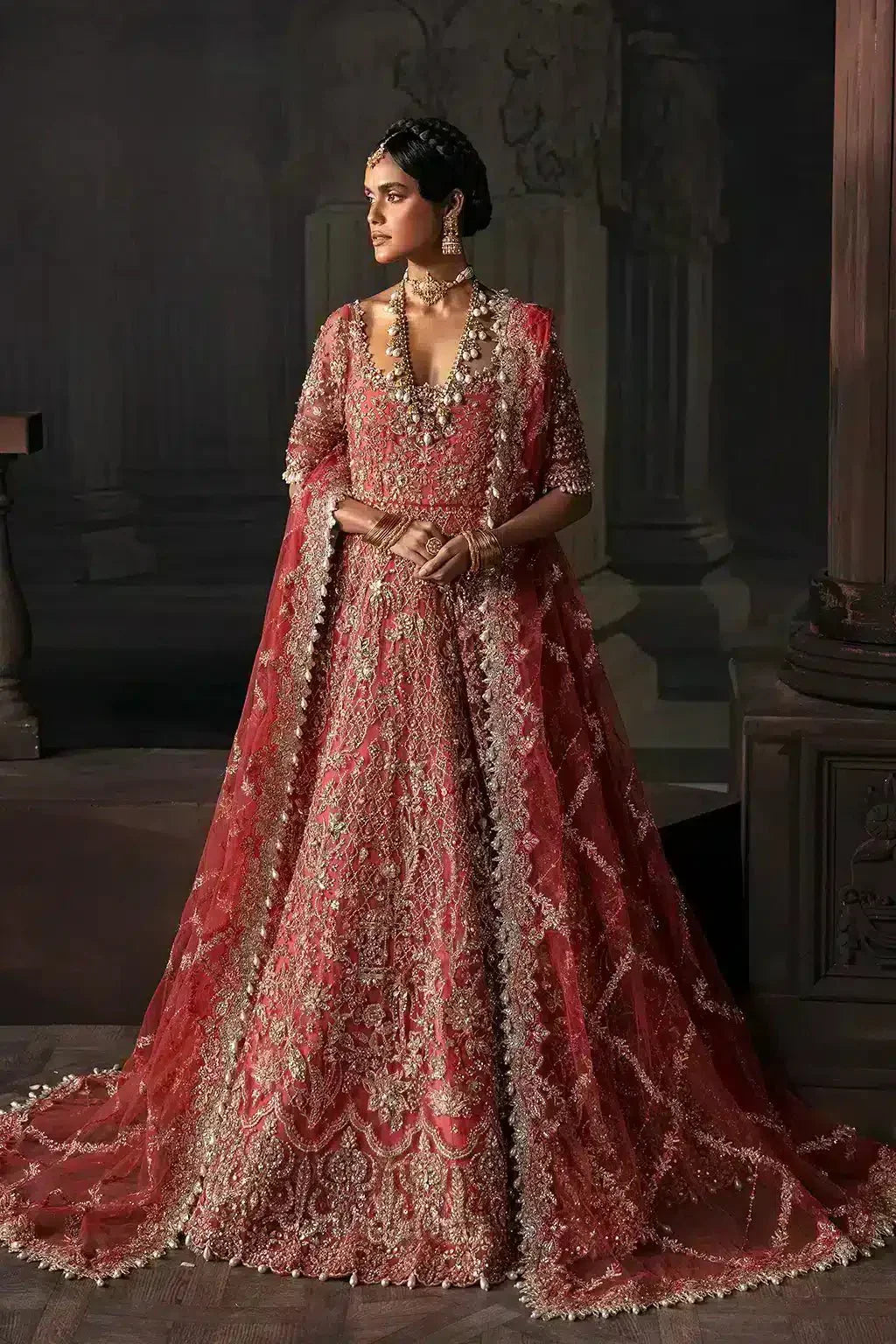 Afrozeh Lavinia bridal dress in rust from The Brides Edit 23, featuring a long peshwas silhouette with ornate embellishments.