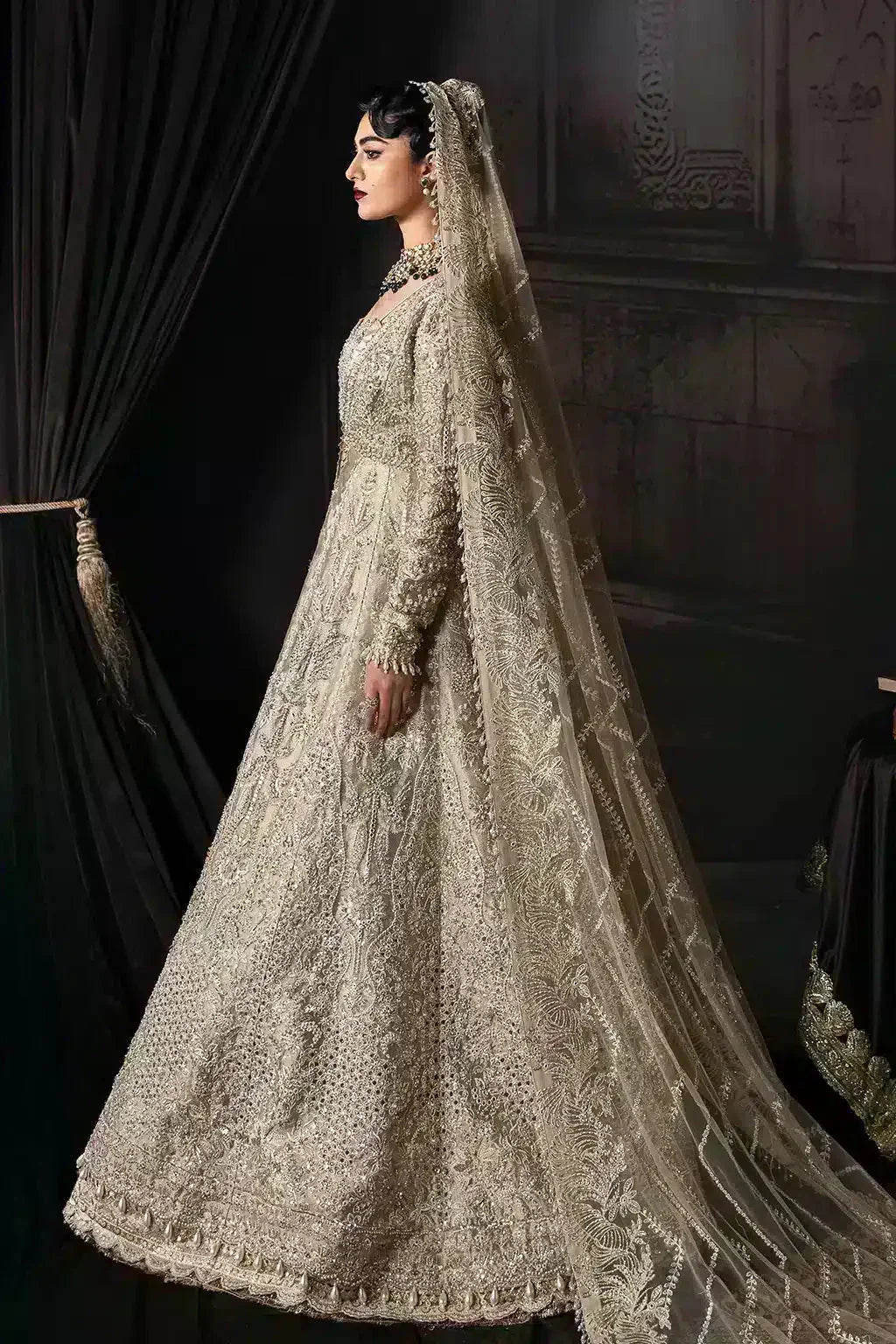 Side profile of Afrozeh The Brides Edit 23 Margaret bridal outfit featuring full-length gold embroidery and flowing dupatta.