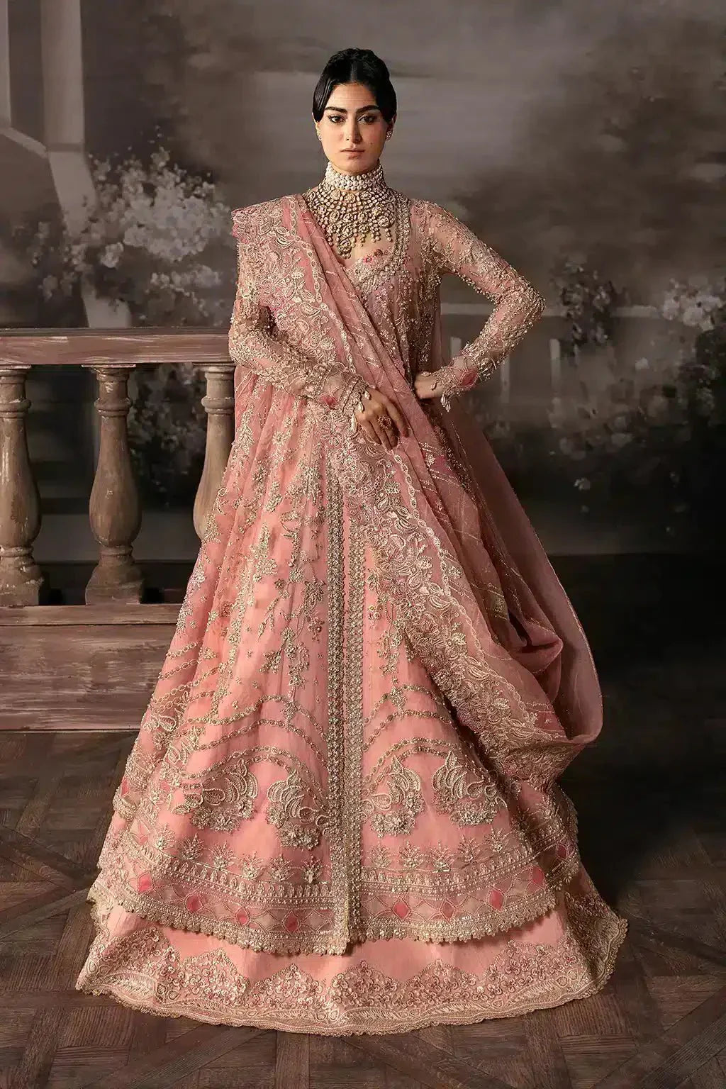 Afrozeh The Brides Edit 23 Victoria bridal dress in tea pink organza, featuring intricate gold embroidery and a slit peshwas with lehnga.