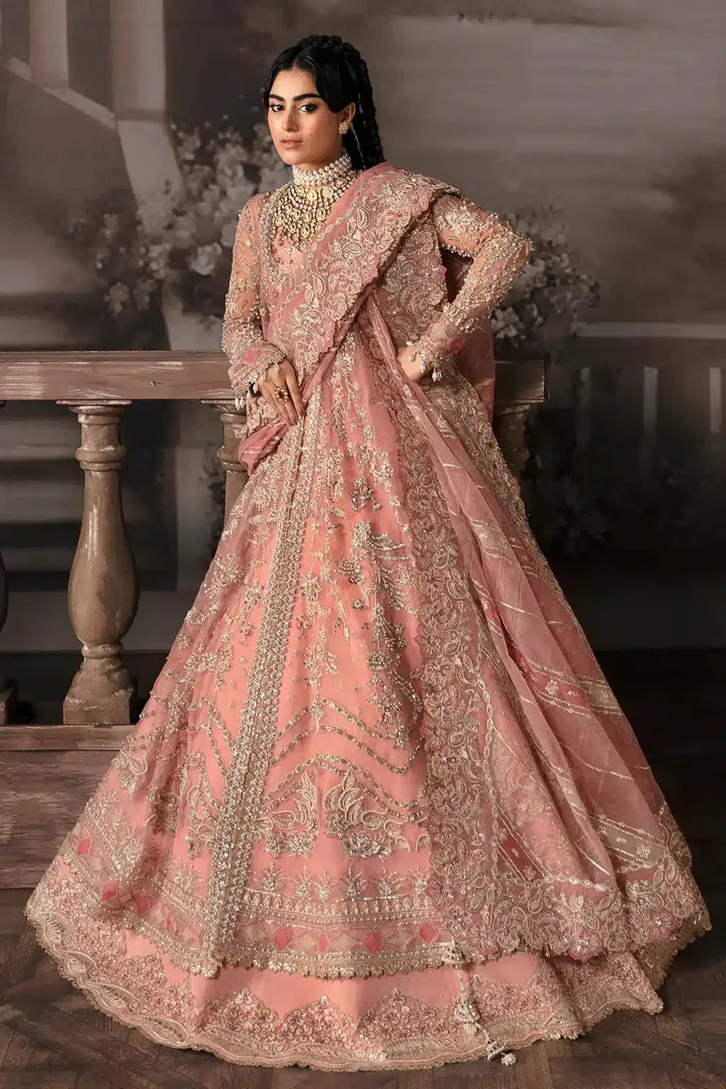 Front pose of Afrozeh The Brides Edit 23 Victoria bridal outfit showcasing ornate embellishments on tea pink slit peshwas and lehnga.