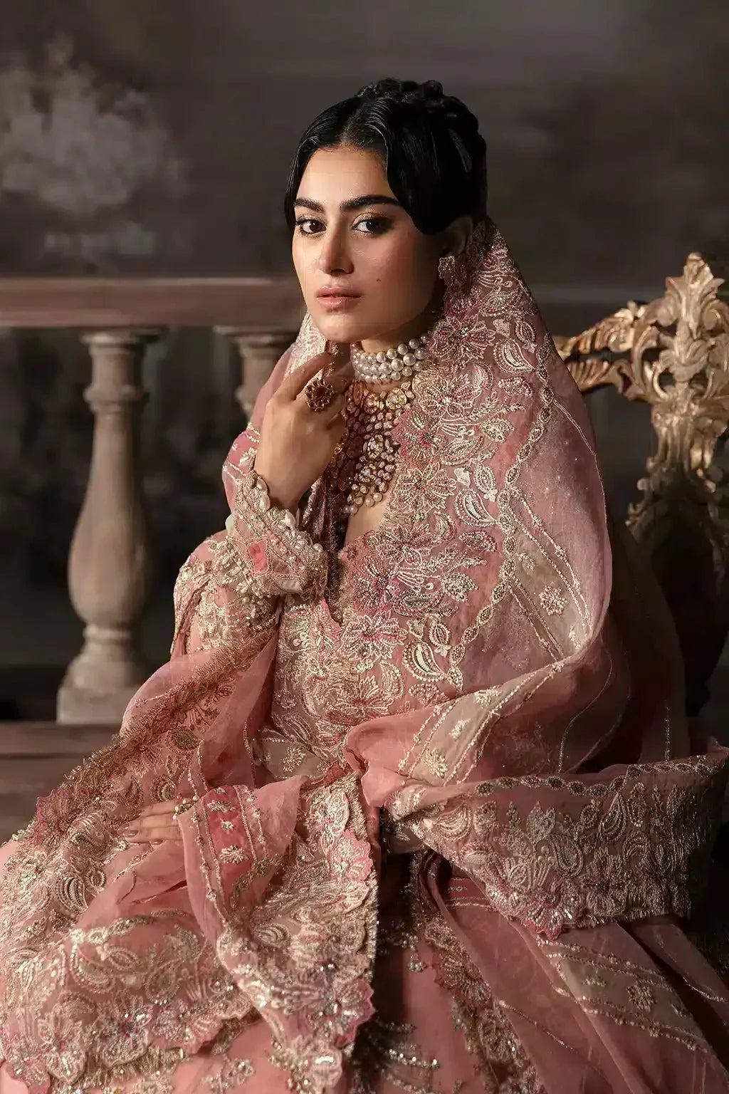 Close-up of Afrozeh The Brides Edit 23 Victoria bridal attire, emphasizing the intricate gold threadwork on the tea pink organza dupatta.
