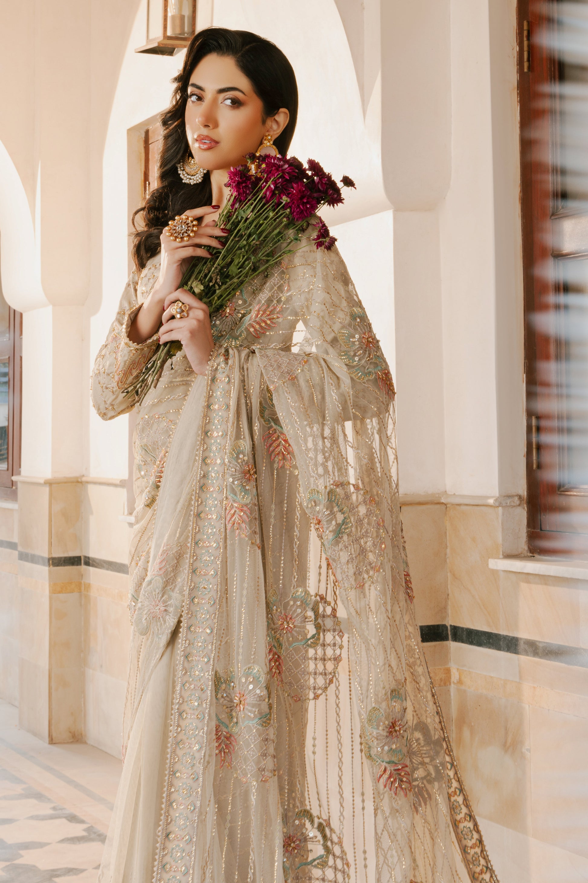 Close‑up of NAQSHI Ramish saree border with line embroidery, subtle sequin play and finely finished minimal lace edge