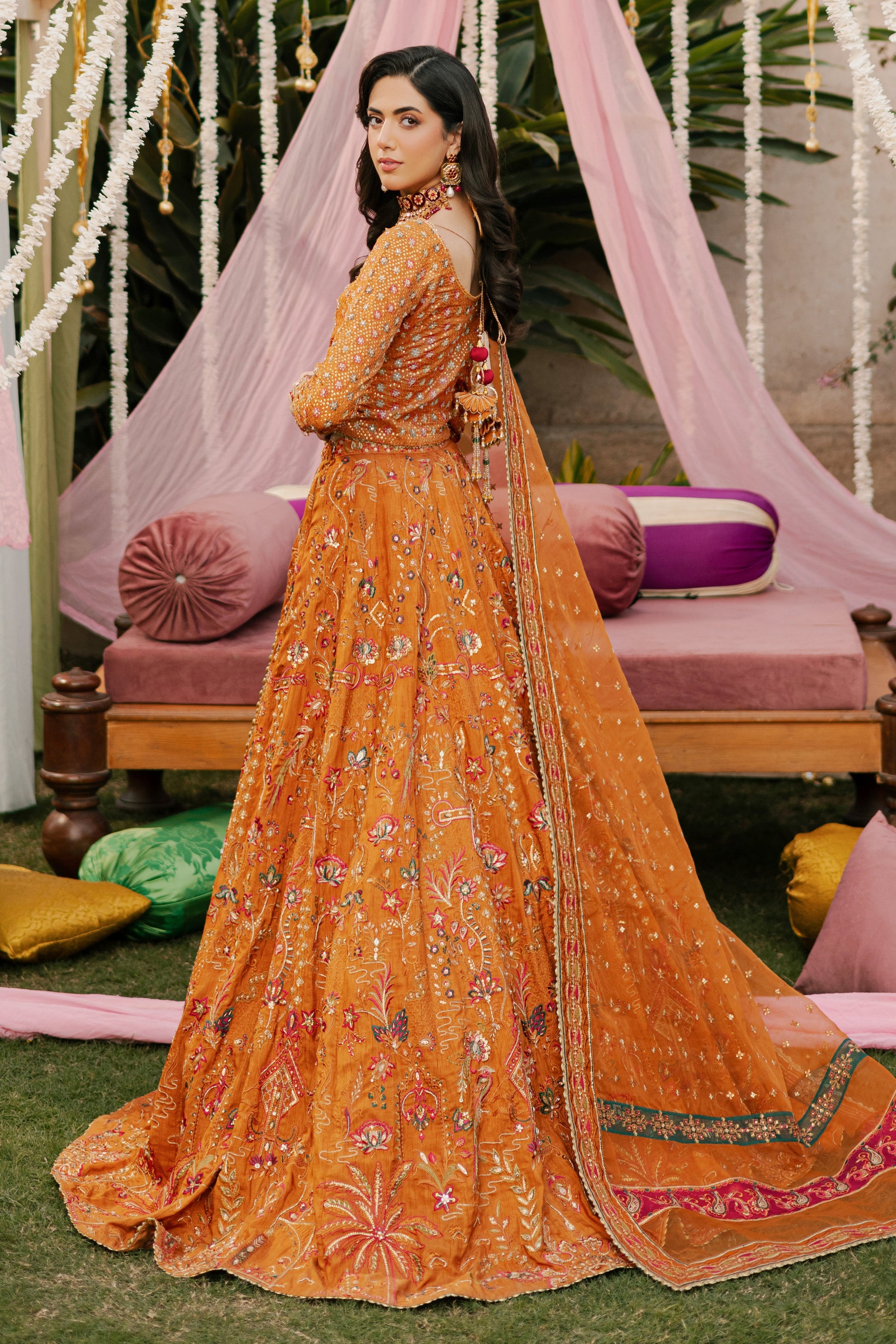 Rear view of NAQSHI Romanvi choli showcasing heavy handmade tassels on back, sequin-adorned sleeves and boat-neck with hand-adda work